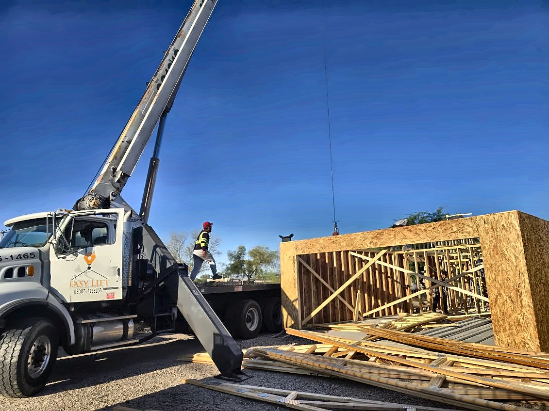 Easy Lift crane beside a timber-framed building